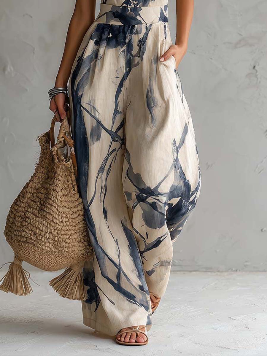 Mono de cuello halter y pernera ancha con estampado lavado en tinta y bolsillos